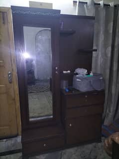 I am selling Double bed with side table. Dressing table. table set