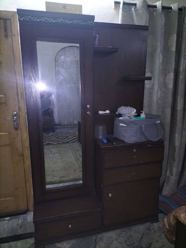 I am selling Double bed with side table. Dressing table. table set 0