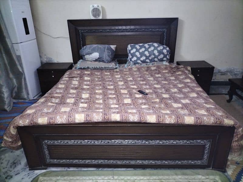 I am selling Double bed with side table. Dressing table. table set 1