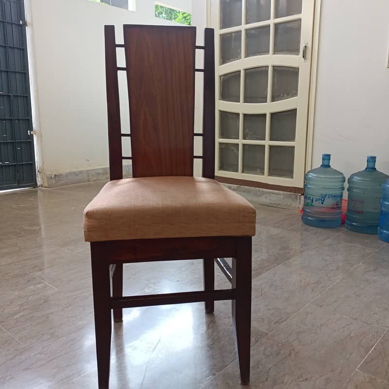 Round Dinning Table with 4 chairs. Glass placed over wooden top 4