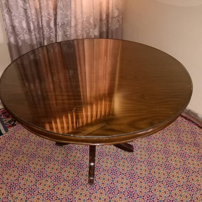 Round Dinning Table with 4 chairs. Glass placed over wooden top 6