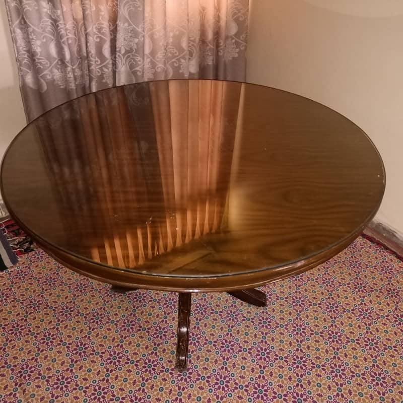 Round Dinning Table with 4 chairs. Glass placed over wooden top 7