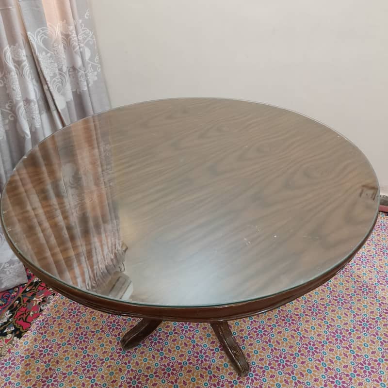 Round Dinning Table with 4 chairs. Glass placed over wooden top 10