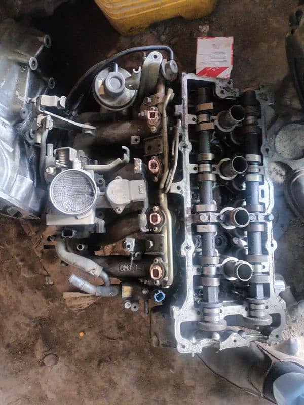 Nissan throatle body with ignit, tapet cover and gearbox etc 6