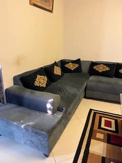 Corner sofa along with table and 6 stools.