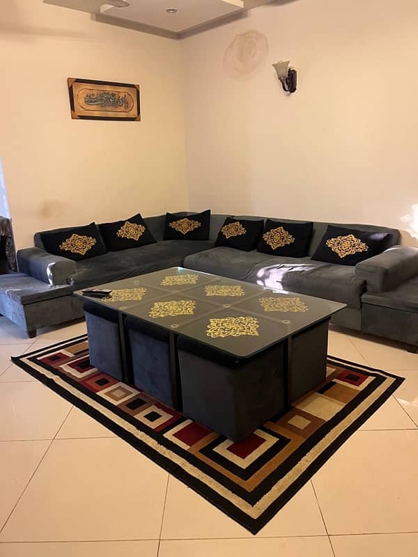 Corner sofa along with table and 6 stools. 3