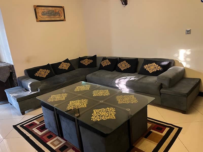 Corner sofa along with table and 6 stools. 4