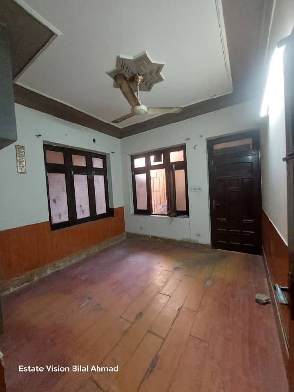 5 Marla Ground floor portion available for rent back side girls university Madina Town 10