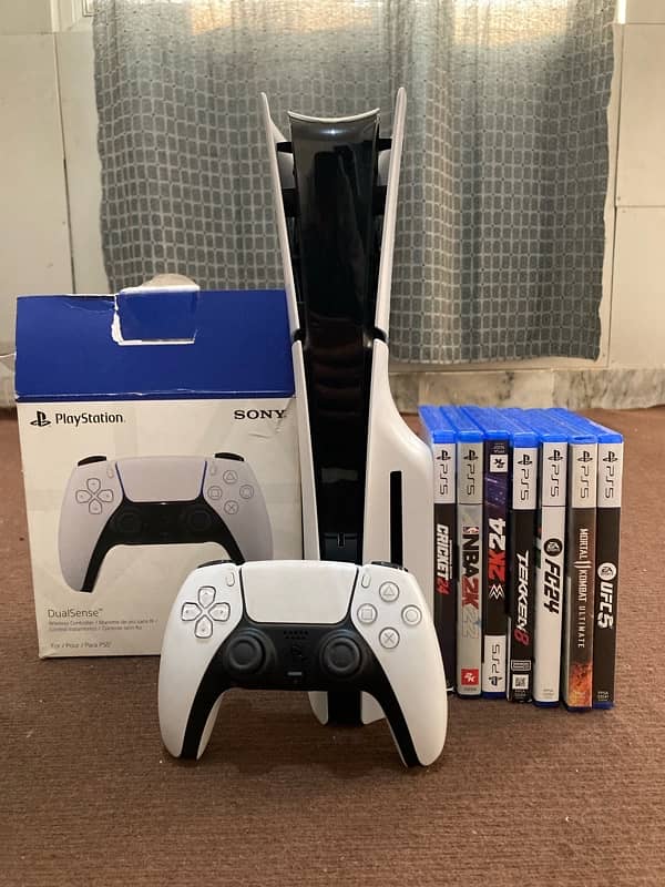 PlayStation 5 with 7 games and 2 controllers 9