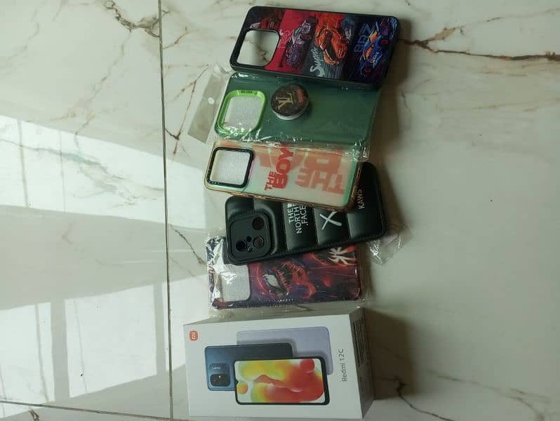 Redmi 12c 4gb ram 128gb rom with box,original charger and 5 covers 6