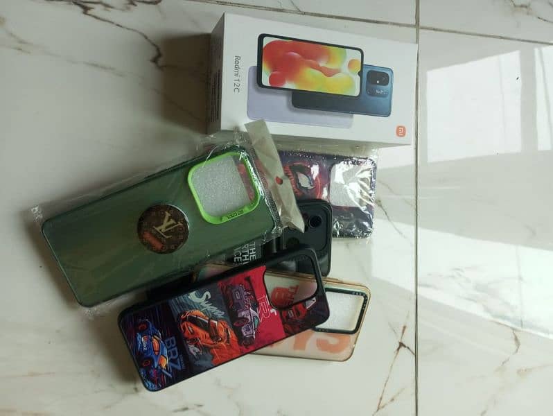 Redmi 12c 4gb ram 128gb rom with box,original charger and 5 covers 7