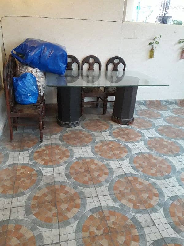 used glass top dining table with 6 chairs for SALE 0