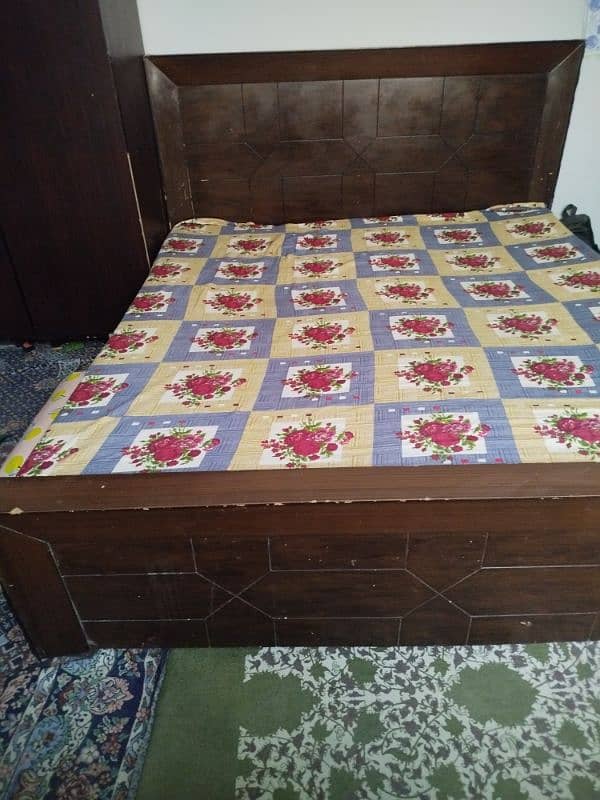 wooden double bed 0