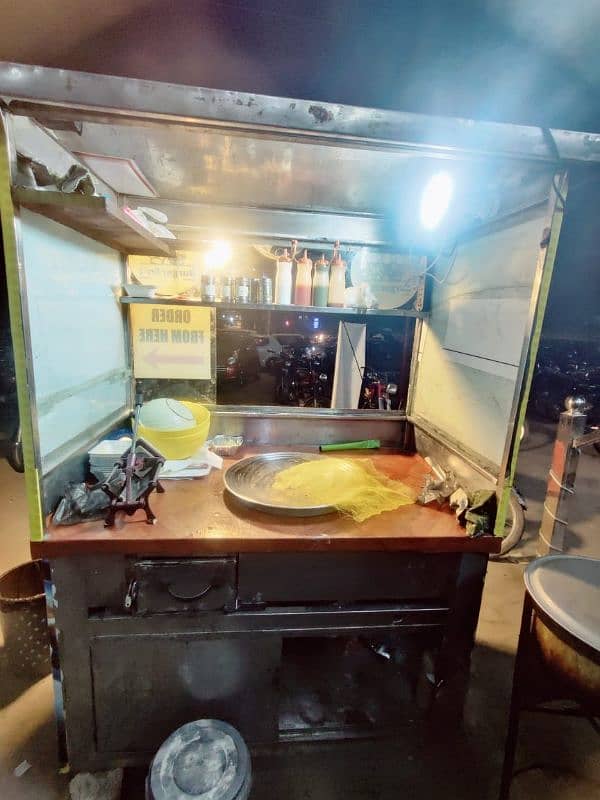 food stall (counter) with Fries item and 2 plastic stool. . . more 0