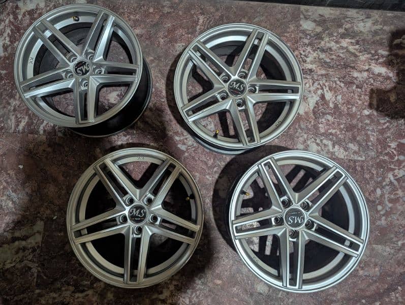 Alloy Rims. 15 inch. 5 Nuts. 1