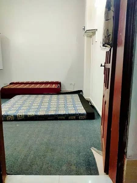 furnished room with attached bathroom and kitchen 3