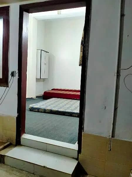 furnished room with attached bathroom and kitchen 4