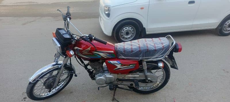 Honda CG-125 red 2023 March Karachi number 1