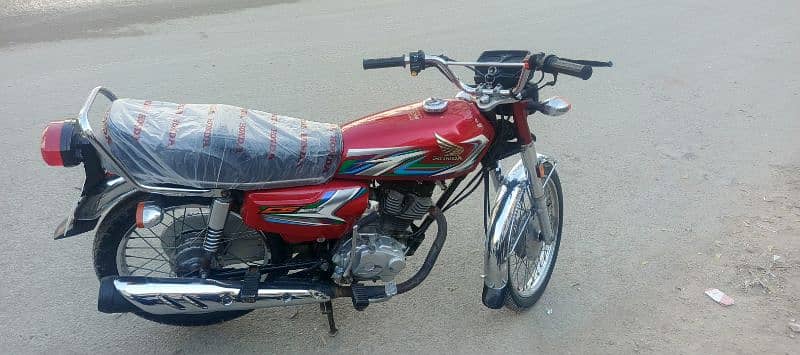 Honda CG-125 red 2023 March Karachi number 2