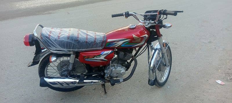 Honda CG-125 red 2023 March Karachi number 5