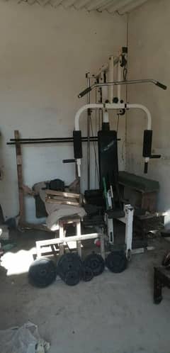 home exercise machine and dumbbells