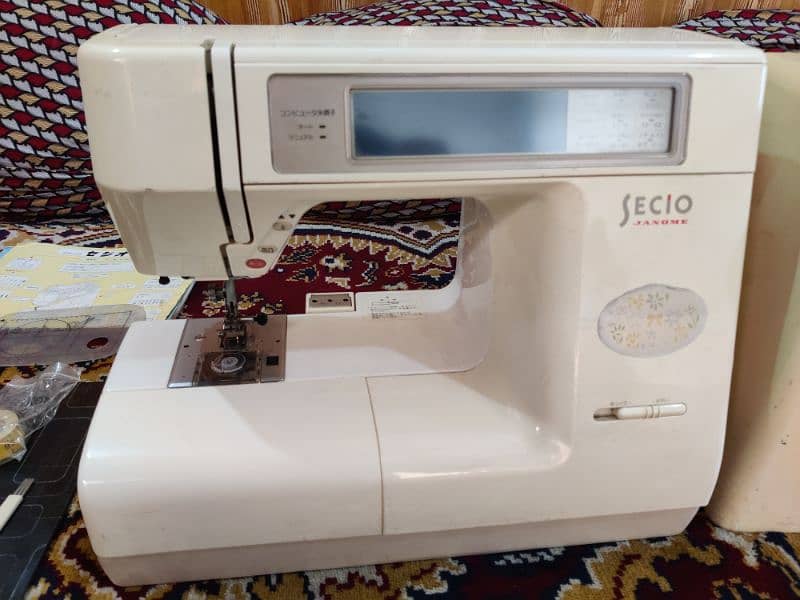 Sewing and embroidery machine 0