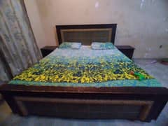 double bed with 2 side tables and dressing table