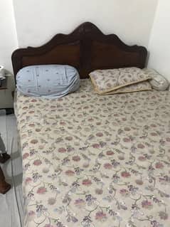 wooden bed with mettress