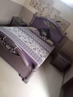 Bed with side tables and dresser