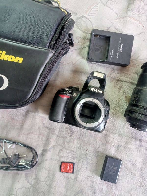 Nikon. d3100 with 18/105 manual lense all assesries price kum nhi honi 3