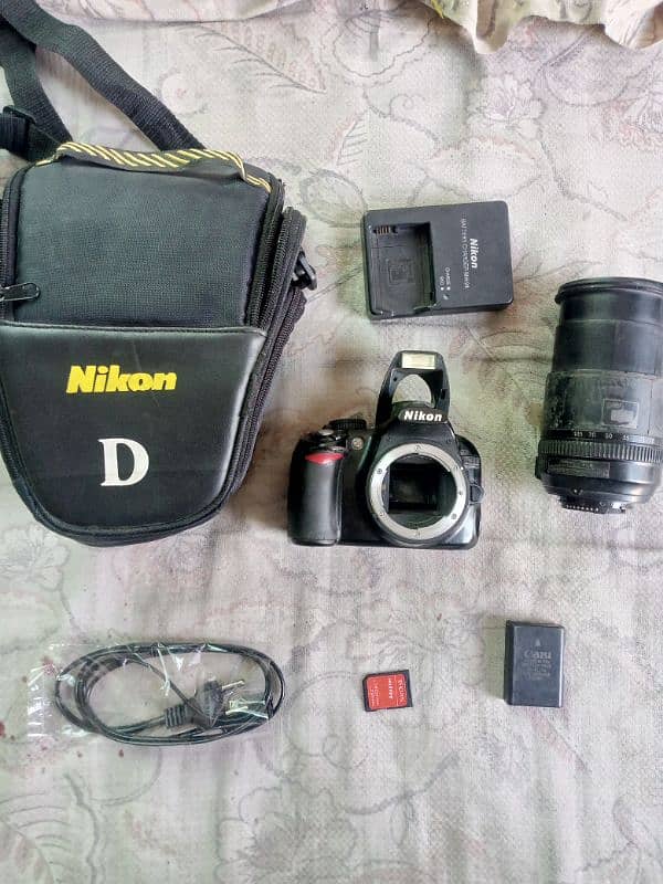 Nikon. d3100 with 18/105 manual lense all assesries price kum nhi honi 4