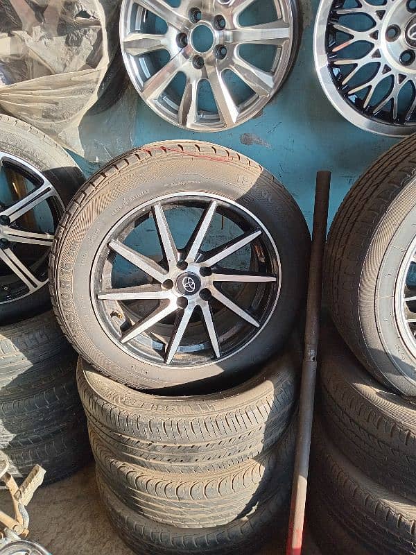 Tyres rims dunlop yokohama  toyota alto vitz suzuki mehran swift coure 2