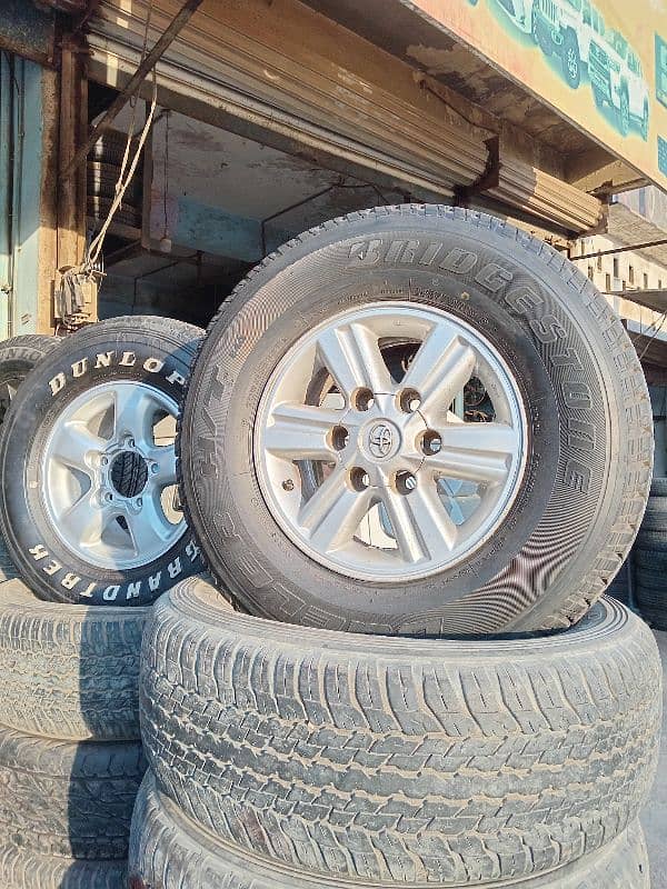 Tyres rims dunlop yokohama  toyota alto vitz suzuki mehran swift coure 9