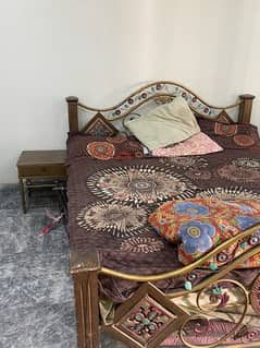 iron bed and side table