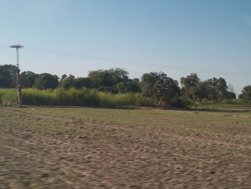 Agriculture  Cum  Residential Land For Sale. Area 2.5 Acre/20 Kanal. On Main Metal Road. Front 300ft. Nearby School, Mosque And Market. 13