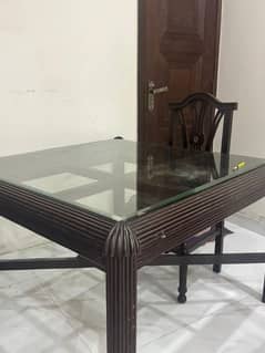 brown dining table with 4 chairs