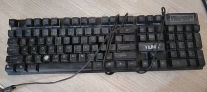 Gaming keyboard with mousepad and mouse