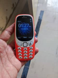 Nokia 3310 mobile and adopter