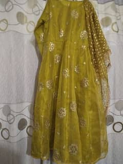 a very beautiful olive green mehndi dress