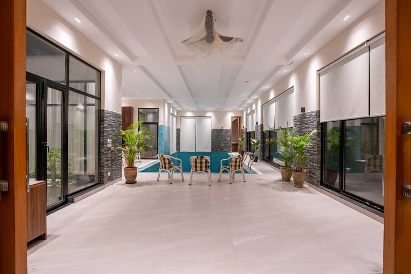 2 KANAL MAZHAR DESIGN ULTRA MODERN FULL BASEMENT FULLY FURNISHED PLUS SWIMMING POOL HOME CENIMA LIFT AND MANY OTHER AMENITIES BANGALOW FOR SALE NEAR TO MCDONALDS. 46