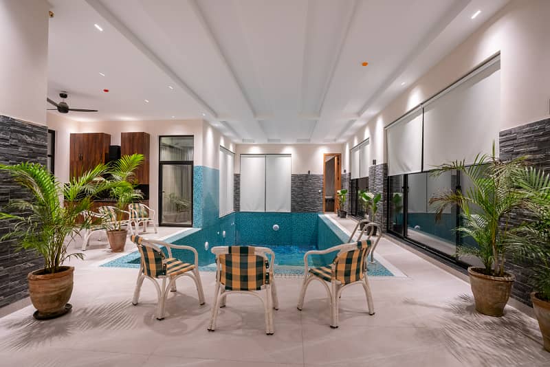 2 KANAL MAZHAR DESIGN ULTRA MODERN FULL BASEMENT FULLY FURNISHED PLUS SWIMMING POOL HOME CENIMA LIFT AND MANY OTHER AMENITIES BANGALOW FOR SALE NEAR TO MCDONALDS. 47