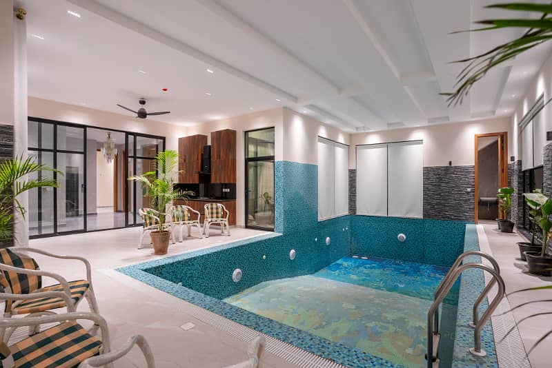 2 KANAL MAZHAR DESIGN ULTRA MODERN FULL BASEMENT FULLY FURNISHED PLUS SWIMMING POOL HOME CENIMA LIFT AND MANY OTHER AMENITIES BANGALOW FOR SALE NEAR TO MCDONALDS. 48