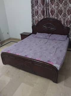 Double bed with side table