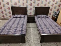 Two Single Beds with side table