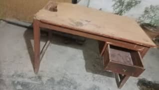 wooden table good condtion front Thora SA damge hy