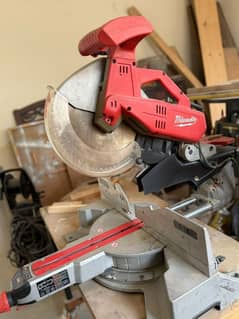 American sliding Mitersaw 12" Milwaukee brand. and other machines