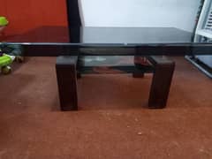 centre table black glass with design in excellent condition