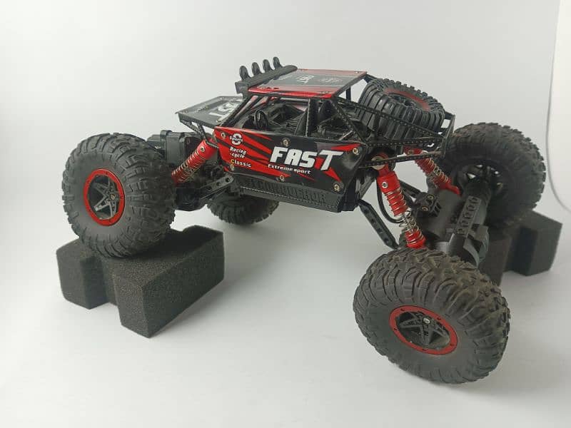 RC Monster truck with shock absorbers and very long battery 2