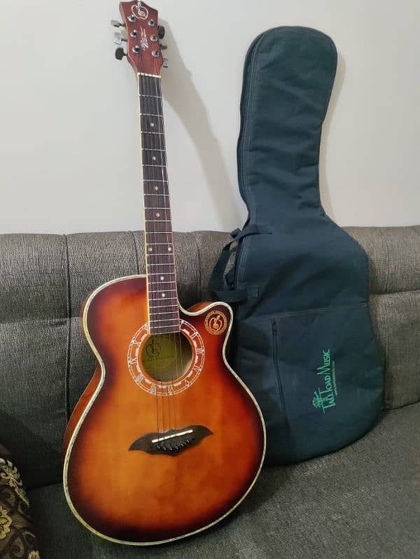 Acoustic guitar with bag,capo and picks 1