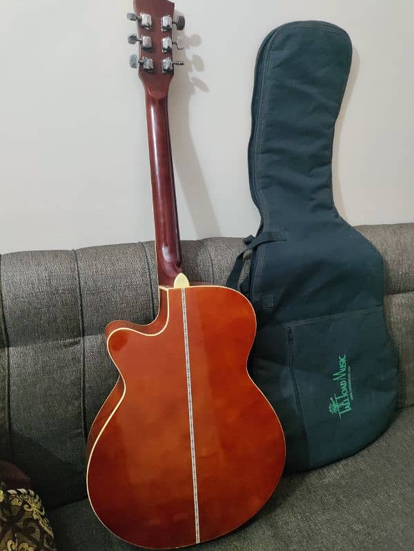 Acoustic guitar with bag,capo and picks 3